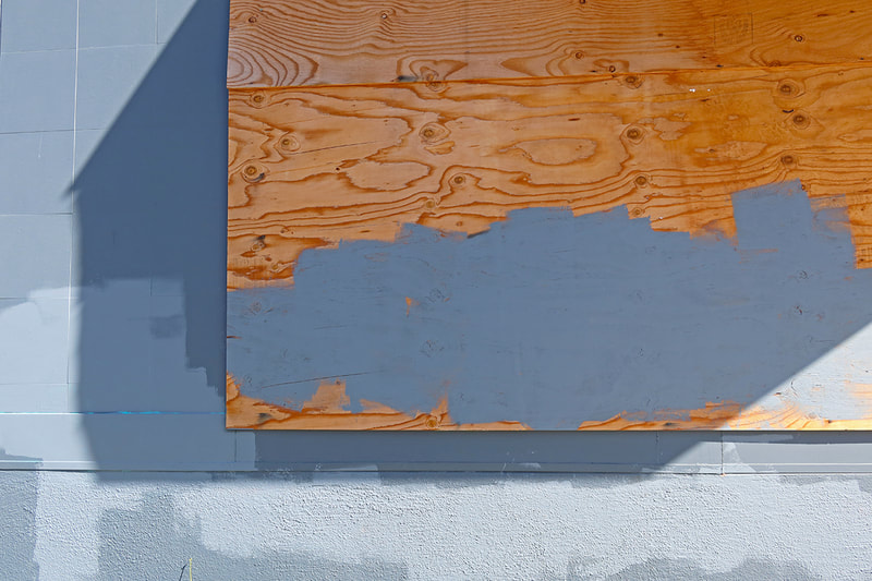 wood on wall with grey paint