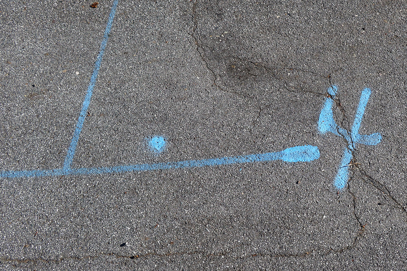 four in blue paint on street