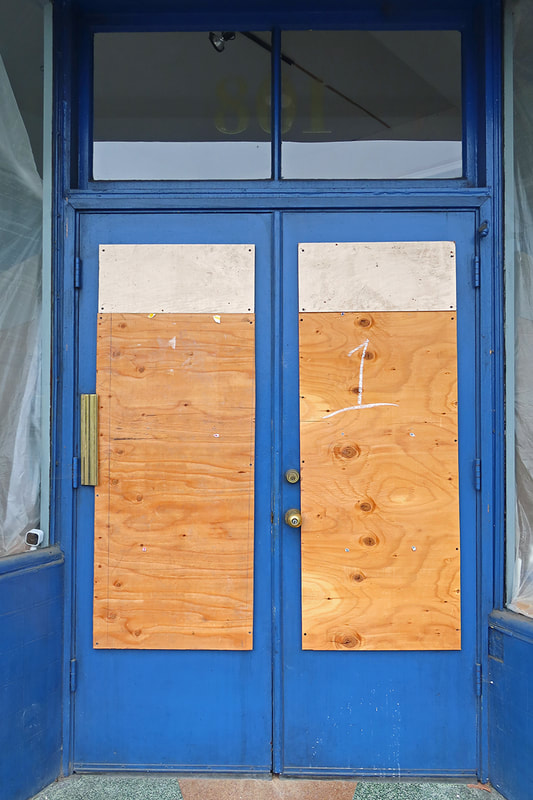 blue door boarded up