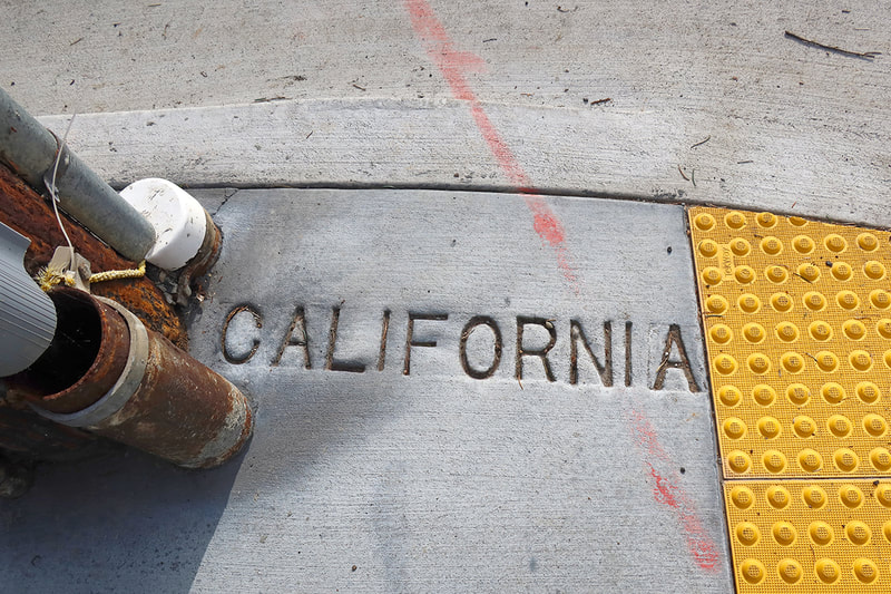 the word California on sidewalk