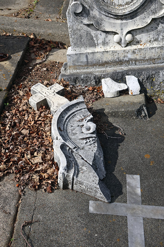 broken gross from gravestone