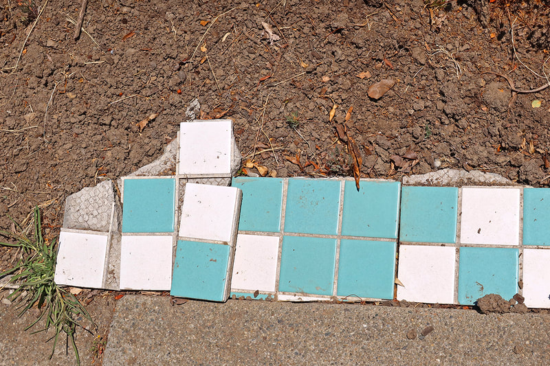 ceramic tiles sitting in dirt