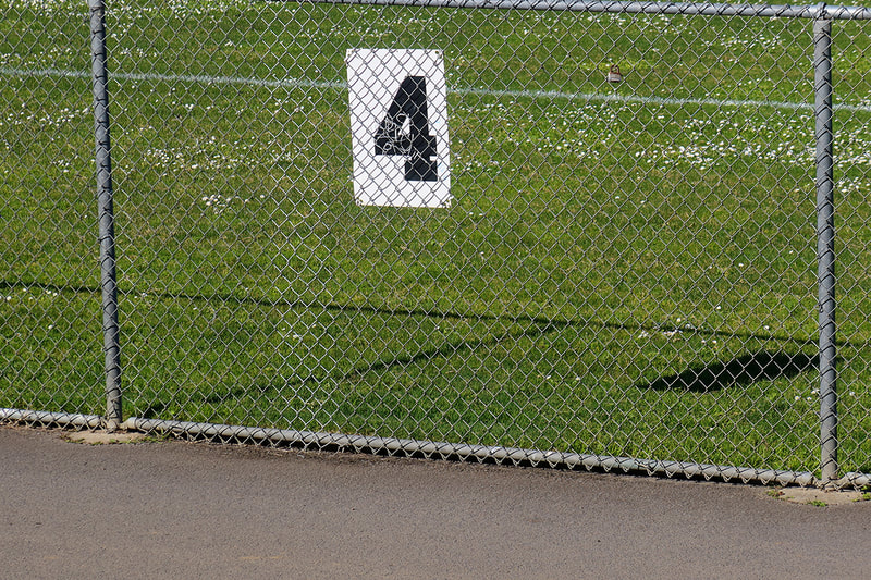 number 4 on fence