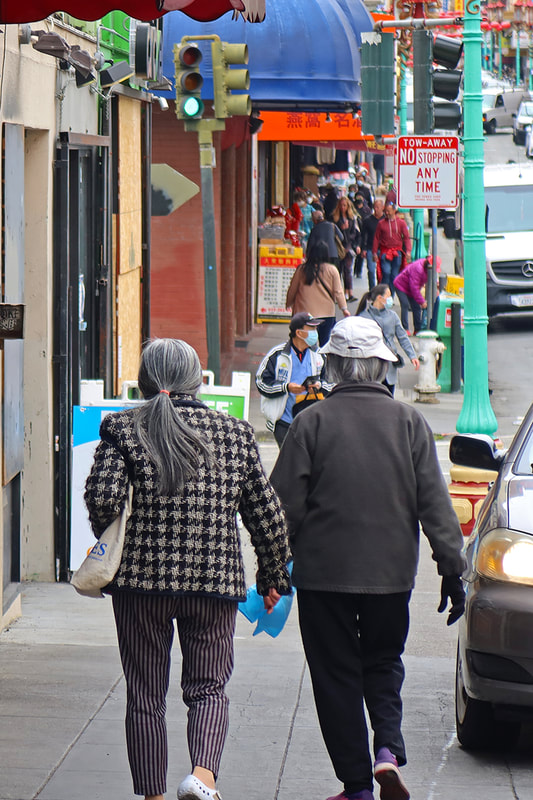 two women walking in chinatown