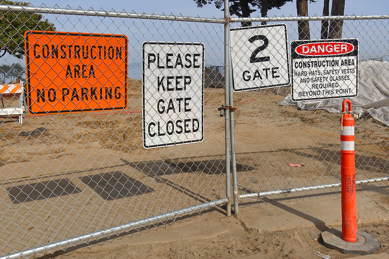 signs on construction gate