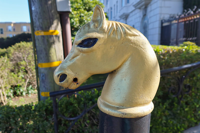 gold horse hitching post