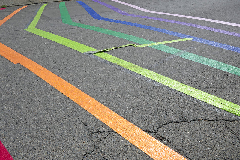 rainbow duct tape on street