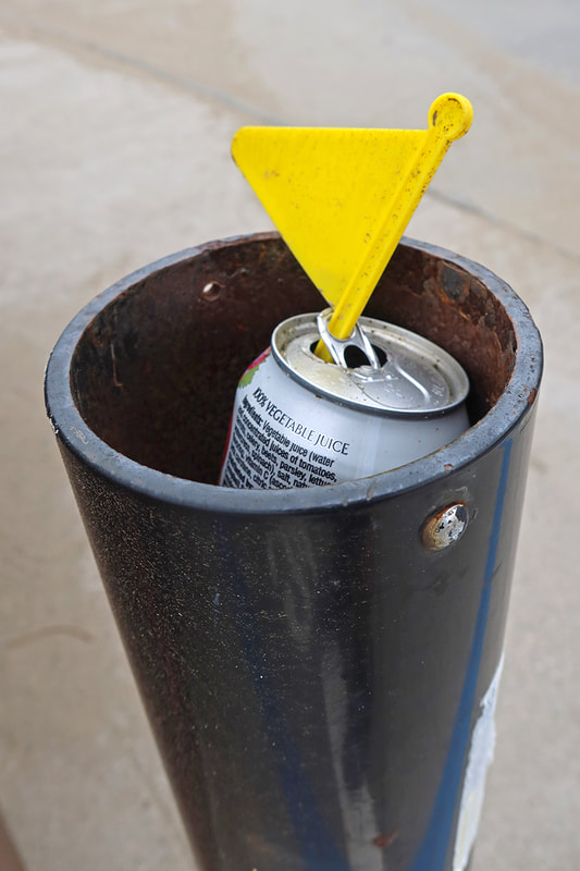 juice can with plastic flag