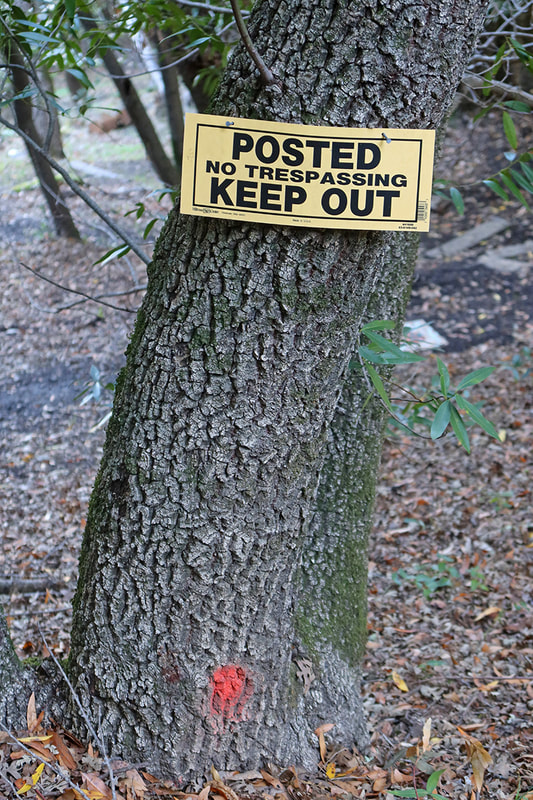 keep out sign on hill