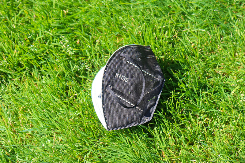 kn95 mask in the grass