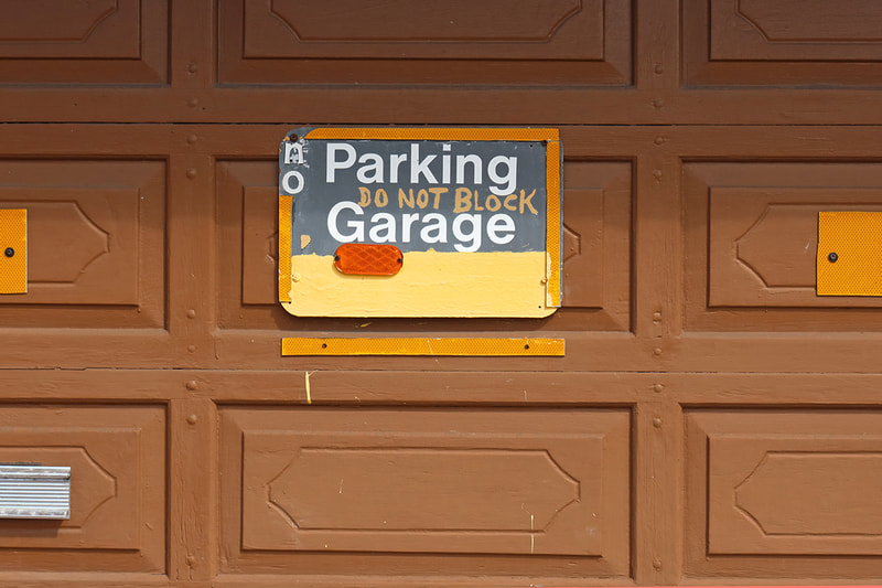no parking sogn on garage door