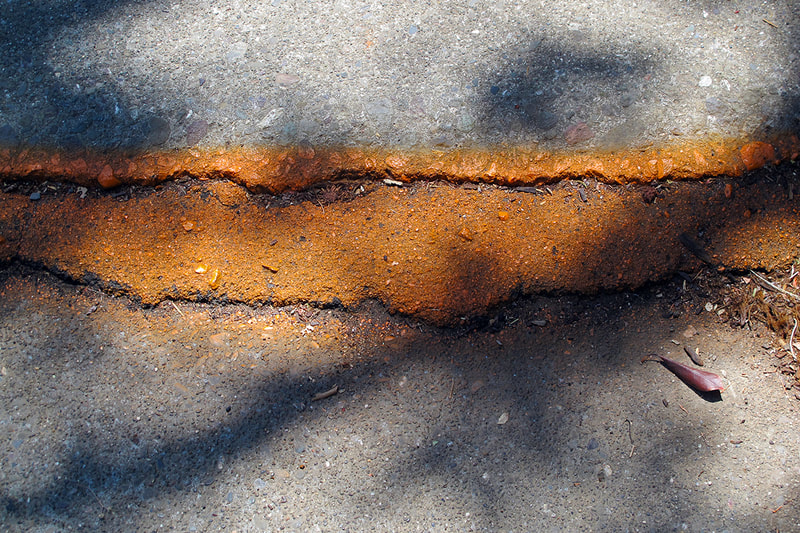 orange paint on asphalt
