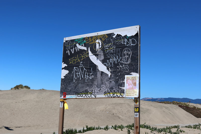 paste up billboard and sand dunes