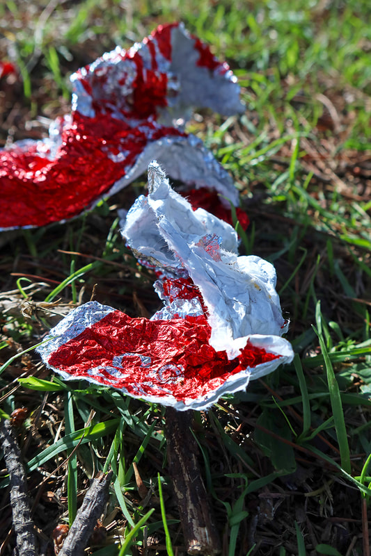 red fast food paper on ground
