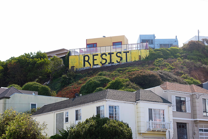 Resist painted on wall on hillside SF