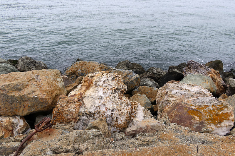 large rocks by water