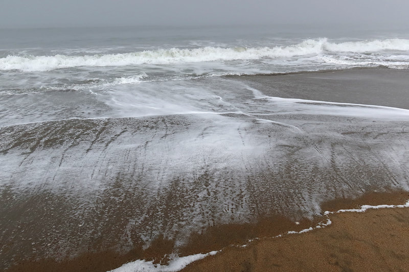 waves washing on sand