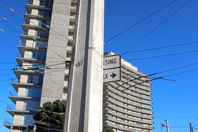 road sign and apartment building