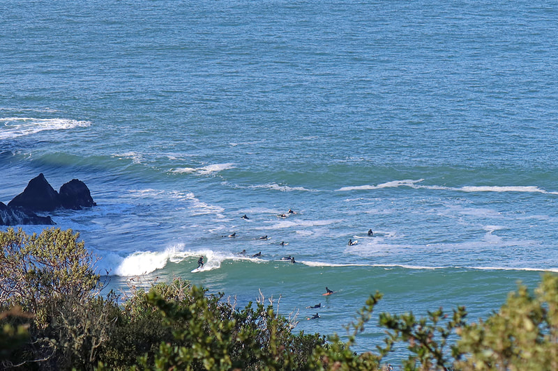 distant shot of surfers at China Beach San Francisco