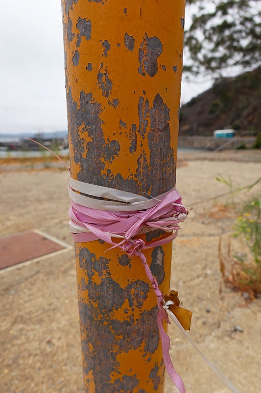 ribbon tied around pole