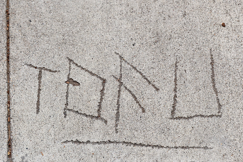tofu written on sidewalk

