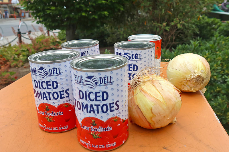 cans of tomatoes and two onions