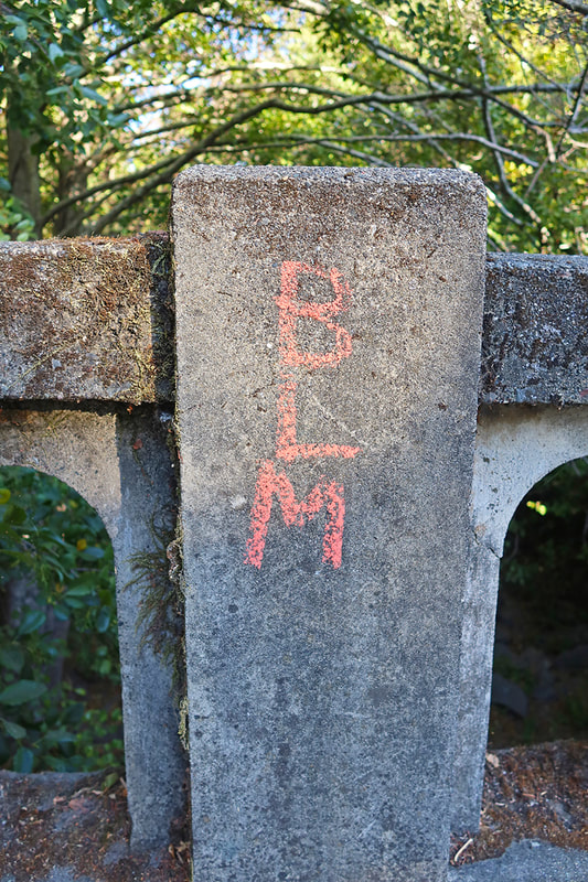 BLM in chalk on bridge
