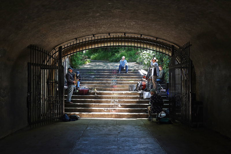 band playing in park tunnel